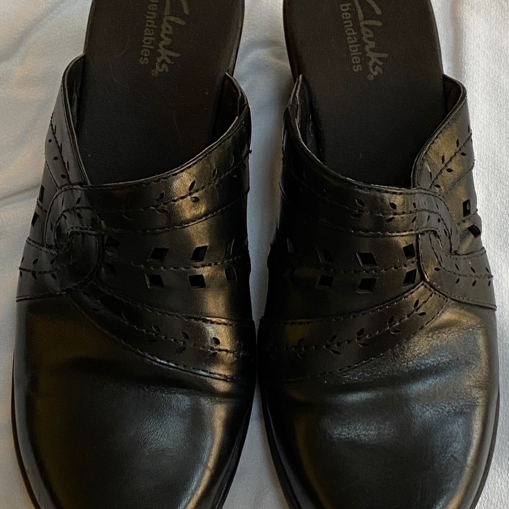 Clarks clogs.